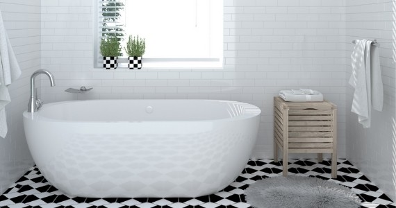 Soak-in white tub with minimalistic accessories and patterned tiles give the bathroom a modern touch
