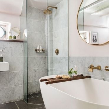 Put your glass bath at the corner of the bathroom to make more space for the other elements