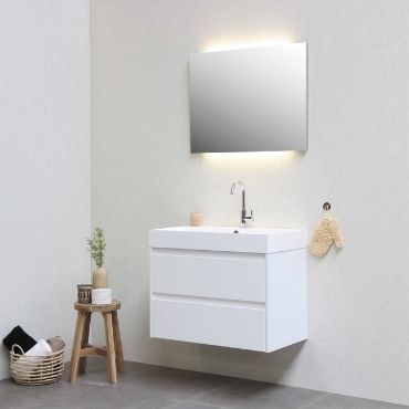Usage of a big mirror makes the bathroom looks spacious