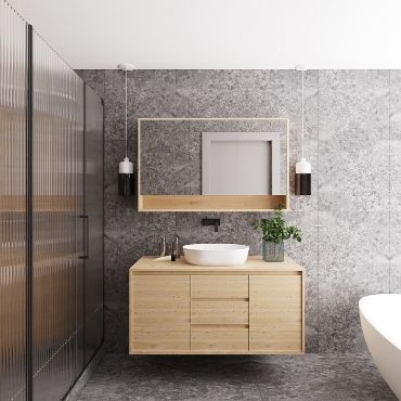 This bathroom is modern and has a textured wall and a brown cabinet vanity