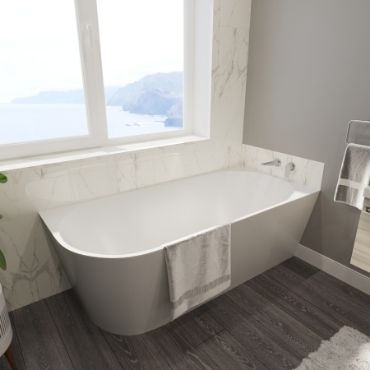 Reeders Bath fitted with a textured wall with a wooden floor