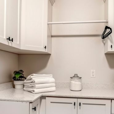 White and Organised Small Laundry Design