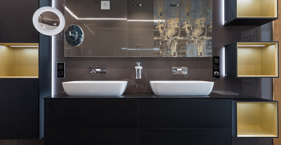 White sinks placed on wooden cabinet in contemporary illuminated bathroom